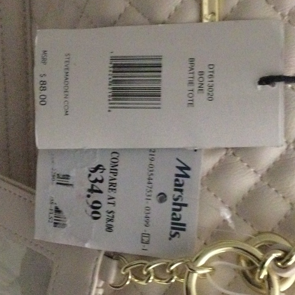 Has a longer detached shoulder straps and has a 4x3 wallet wristlet attached